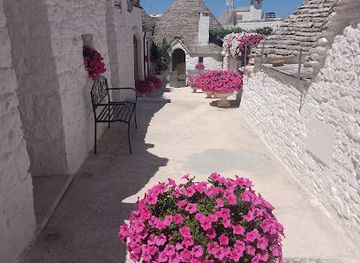italy/puglia/attraction/alberobello-painted-rooftops-photo-spot