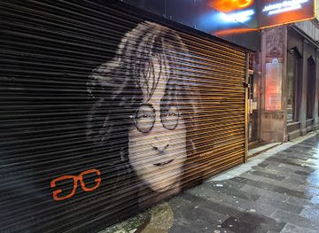 united-kingdom/liverpool/attraction/john-lennon-mural-by-paul-curtis