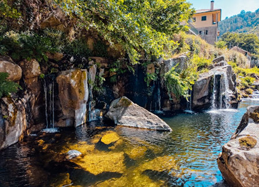 Discover the serene beauty of Poço Negro, a captivating tourist attraction in Portugal featuring lush landscapes and tranquil waters.