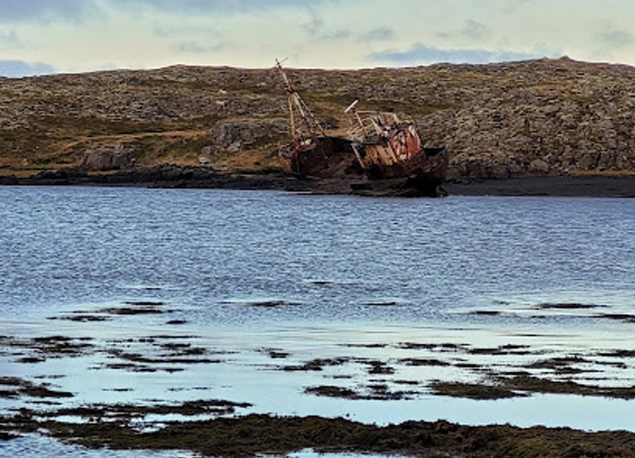 Experience the serene beauty of Bootswrack, a captivating tourist attraction in Breidhabolsstadhur, surrounded by Iceland's breathtaking nature.