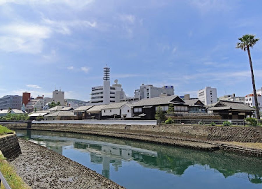 Experience the serene beauty and rich history at Dejimaomotemonbashi Park in Nagasaki, the perfect escape for nature lovers and history enthusiasts.