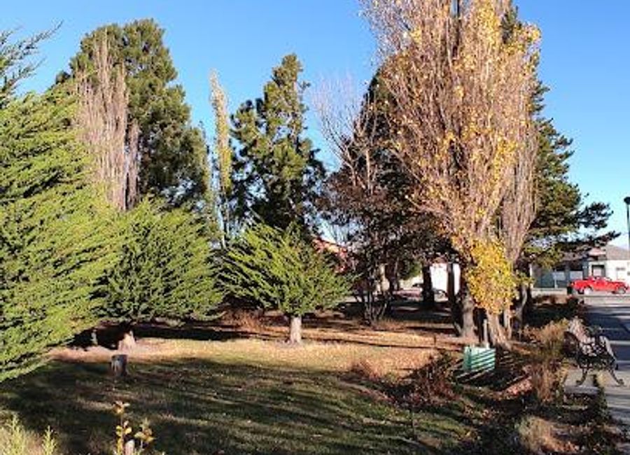 Experience the serene beauty and cultural vibrancy of Plaza Bernardo O'Higgins in Puerto Natales, a must-visit city park in the heart of Patagonia.