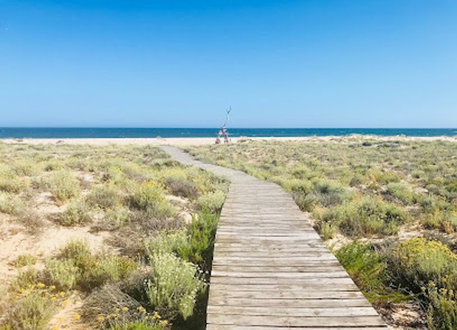 Experience the serene beauty of Cabo de Santa Maria, a tranquil beach paradise in the Algarve, perfect for relaxation and exploration.
