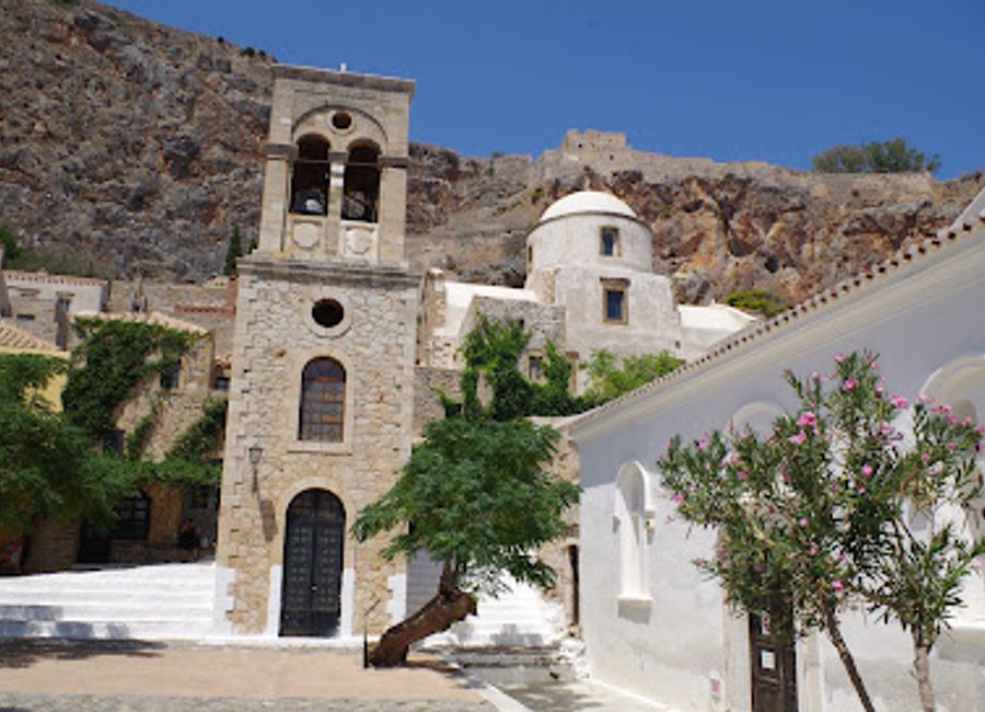 Explore Elkomenos Christos, a magnificent Greek Orthodox church in Monemvasia, rich in history and breathtaking architecture amidst stunning coastal views.