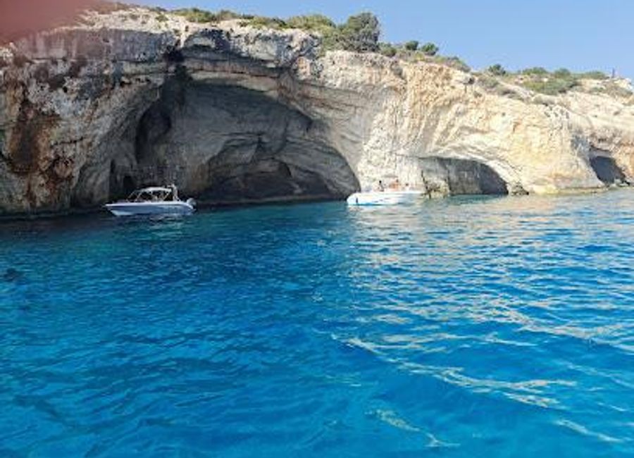 Discover the mesmerizing Blue Caves of Zakynthos: Swim in vibrant turquoise waters and explore stunning natural arches along the island's coast.