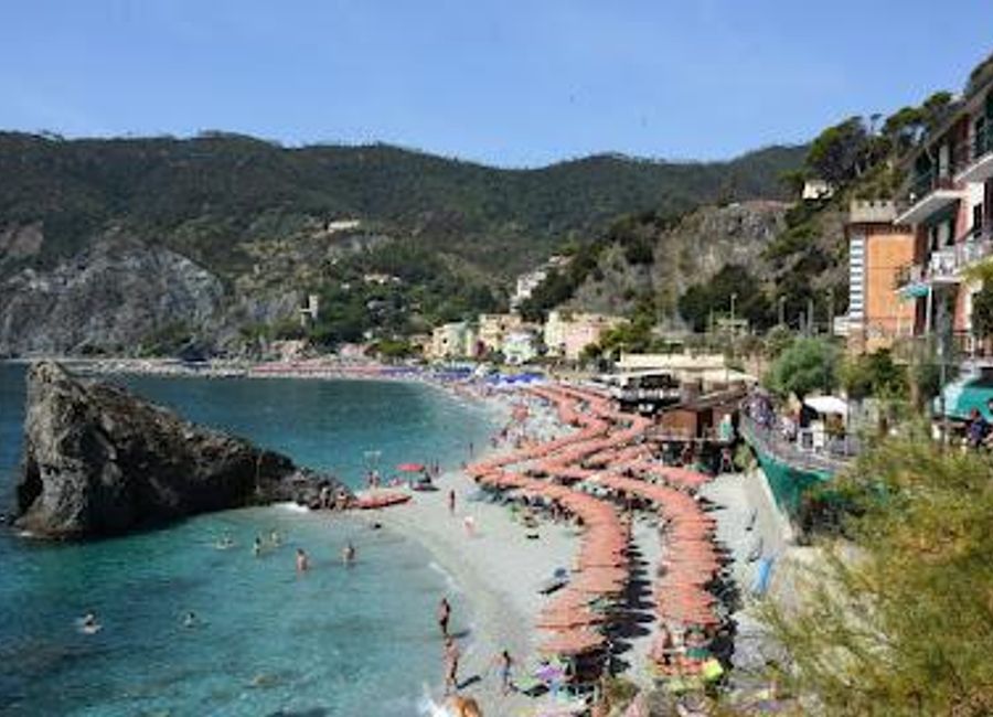 Explore Monterosso al Mare, the largest village of Cinque Terre, where stunning beaches, rich history, and delightful cuisine await every traveler.