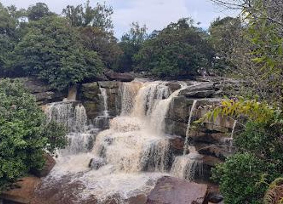Escape to Popokvil Waterfall in Bokor National Park for a refreshing retreat amidst stunning natural beauty and tranquil surroundings.