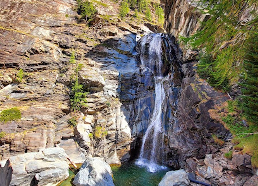 Discover the breathtaking beauty of Cascata Biolet, a stunning waterfall in Aosta Valley, surrounded by serene nature and picturesque hiking trails.