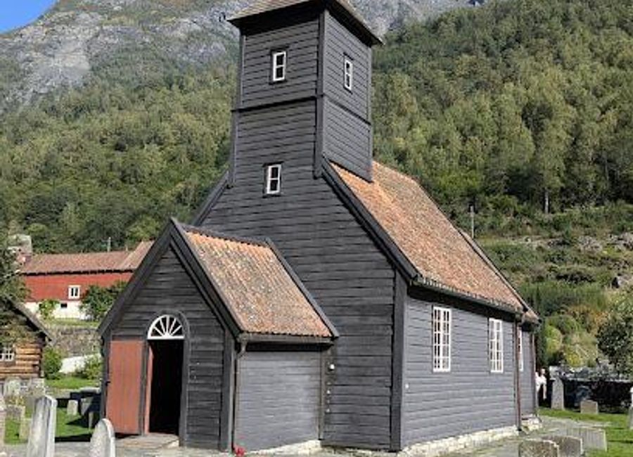 Discover the enchanting Flåm Church, where spirituality meets stunning fjord landscapes in Norway's picturesque village.