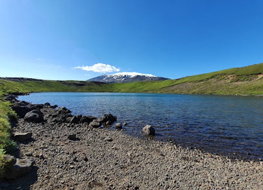 Experience the serene beauty of Bárðarlaug, a hidden gem in Hellnar, Iceland, surrounded by breathtaking landscapes and unique geological formations.