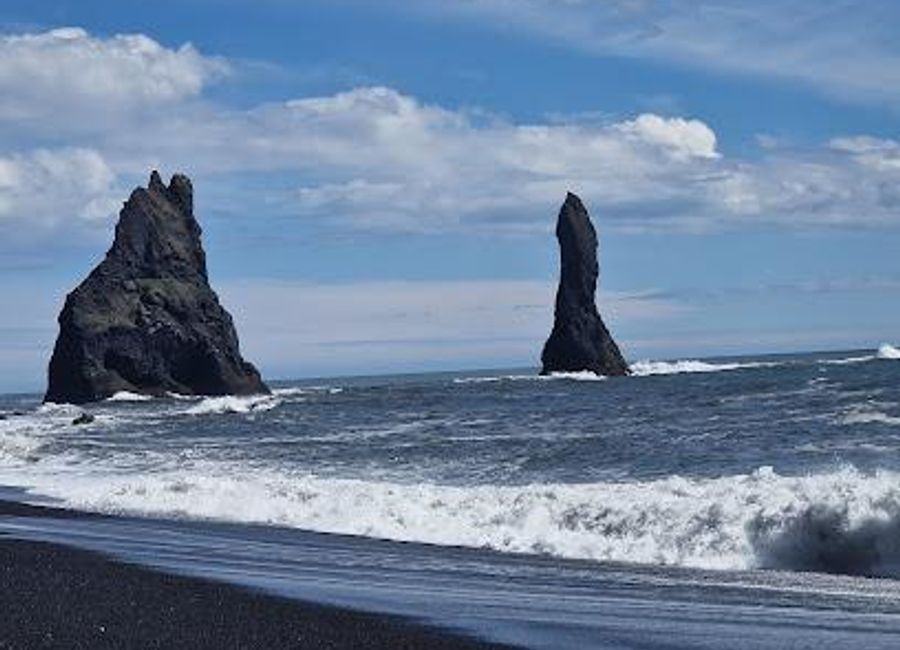 Explore the stunning Reynisfjall peak in Iceland, where breathtaking views and unique geological formations await every visitor.