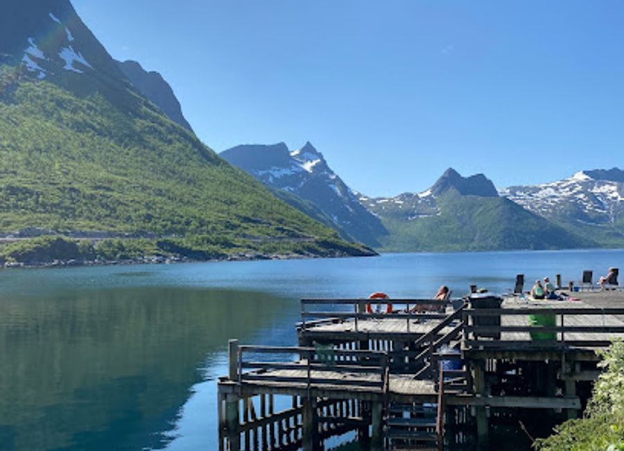 Experience the breathtaking views and serene atmosphere of Mefjordbotn Pier, a hidden gem in Norway's stunning Senjahopen region.