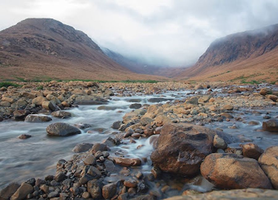 Explore the breathtaking Tablelands, a UNESCO World Heritage Site in Newfoundland and Labrador, where unique geological formations meet stunning landscapes.