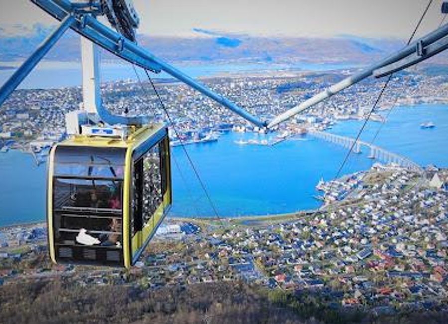 Experience the stunning panoramic views of Tromsø from Fjellheisen, your gateway to the Arctic landscape and breathtaking adventures.
