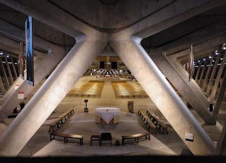 Discover the Basilica of St. Pius X in Lourdes, an awe-inspiring underground church accommodating thousands of pilgrims, offering a unique spiritual experience and modern architectural marvel.