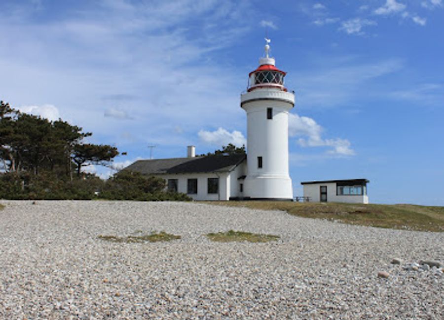 Explore the scenic beauty and rich maritime history of Sletterhage Fyr, a breathtaking lighthouse along Denmark's stunning coastline.