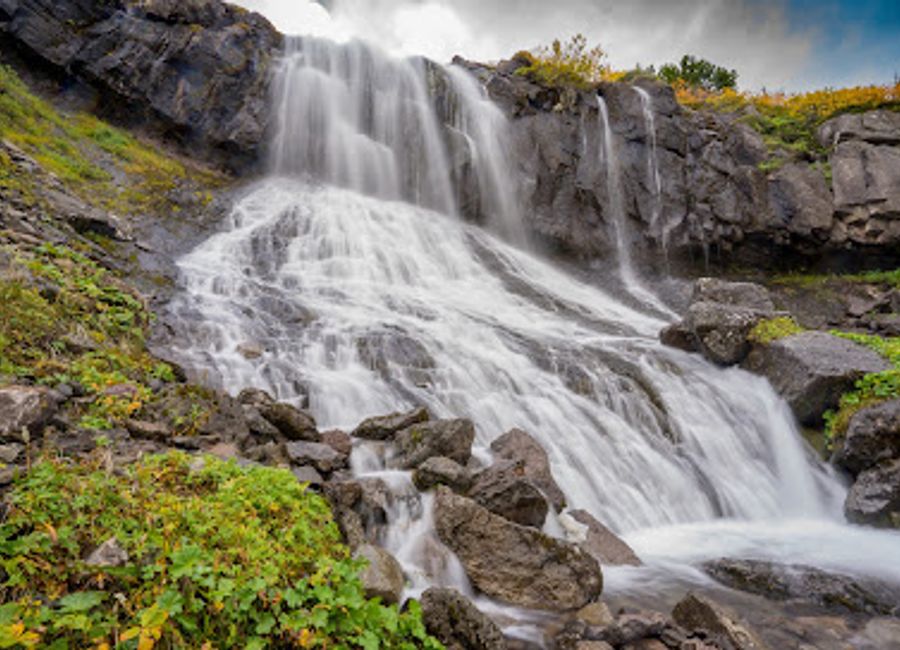 Experience the breathtaking beauty of Bunárfoss Waterfall in Ísafjörður, a serene natural wonder that captivates all who visit.