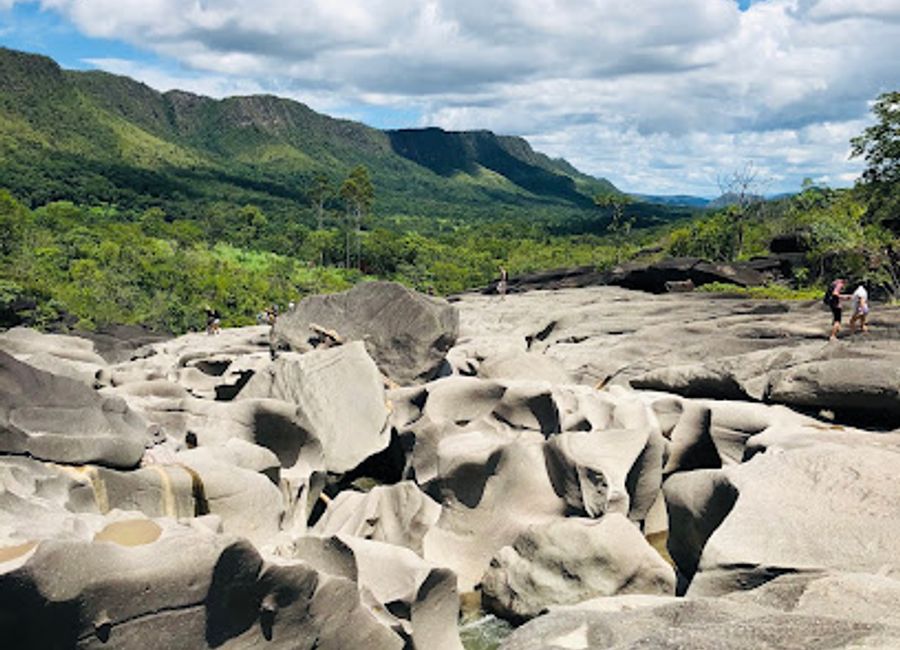 Explore Brazil's Vale da Lua: Hike through otherworldly rock formations, swim in natural pools, and discover a lunar-like landscape.