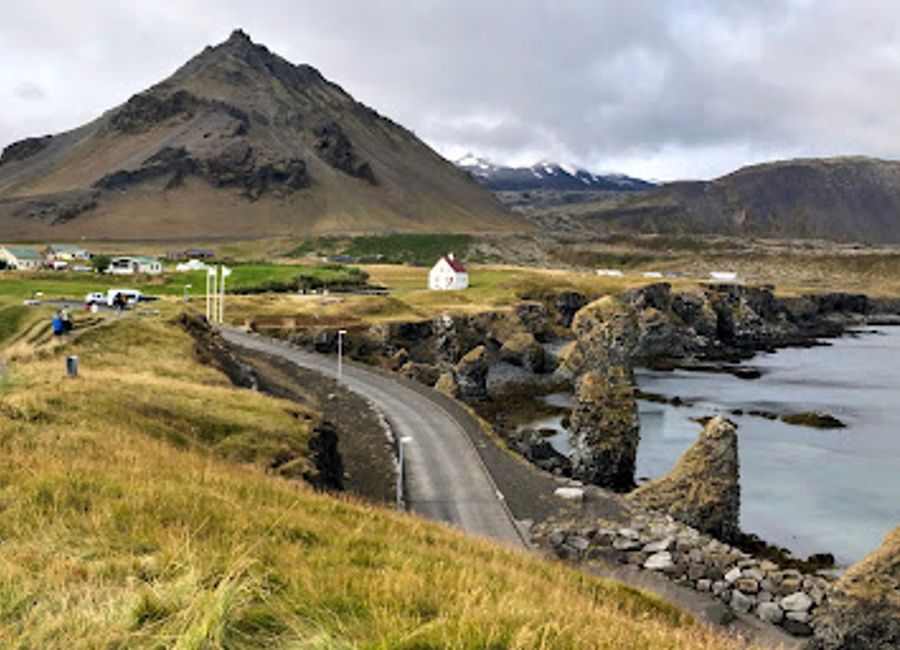 Experience the breathtaking views and serene atmosphere at Súgandisey Island Lighthouse, a must-visit attraction in Stykkishólmur, Iceland.
