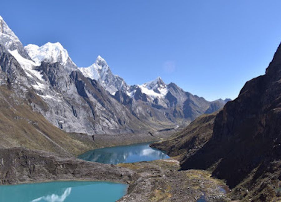 Embark on the breathtaking Huayhuash Trek in Peru, where stunning mountain views and vibrant culture await outdoor enthusiasts.