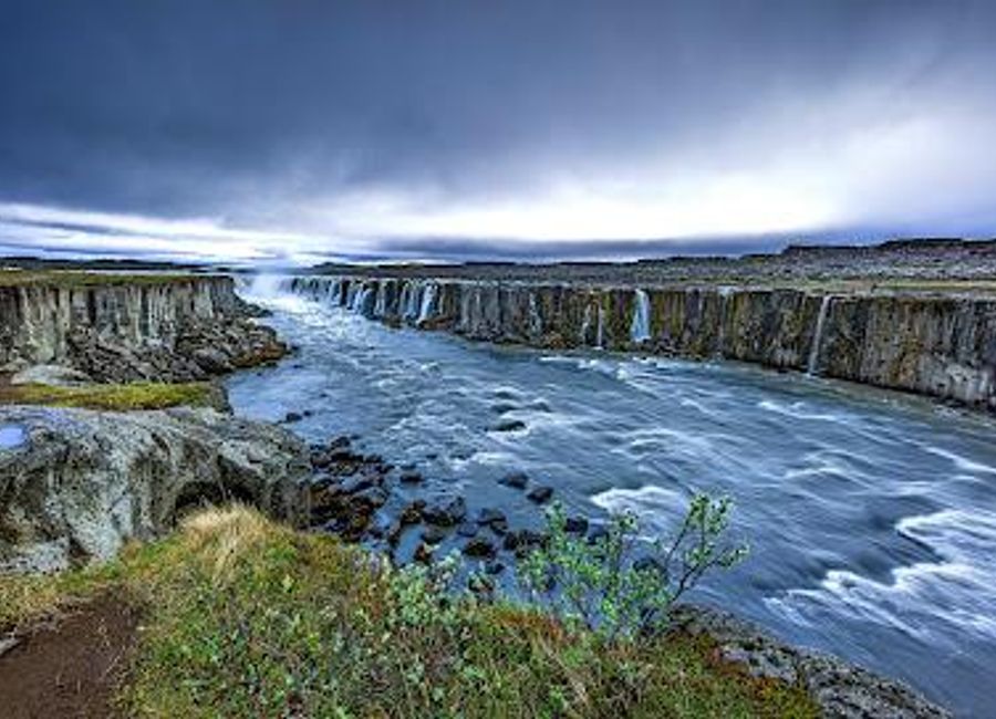 Experience the breathtaking beauty of Selfoss Waterfall in Iceland, a natural wonder that captivates with its stunning views and serene surroundings.