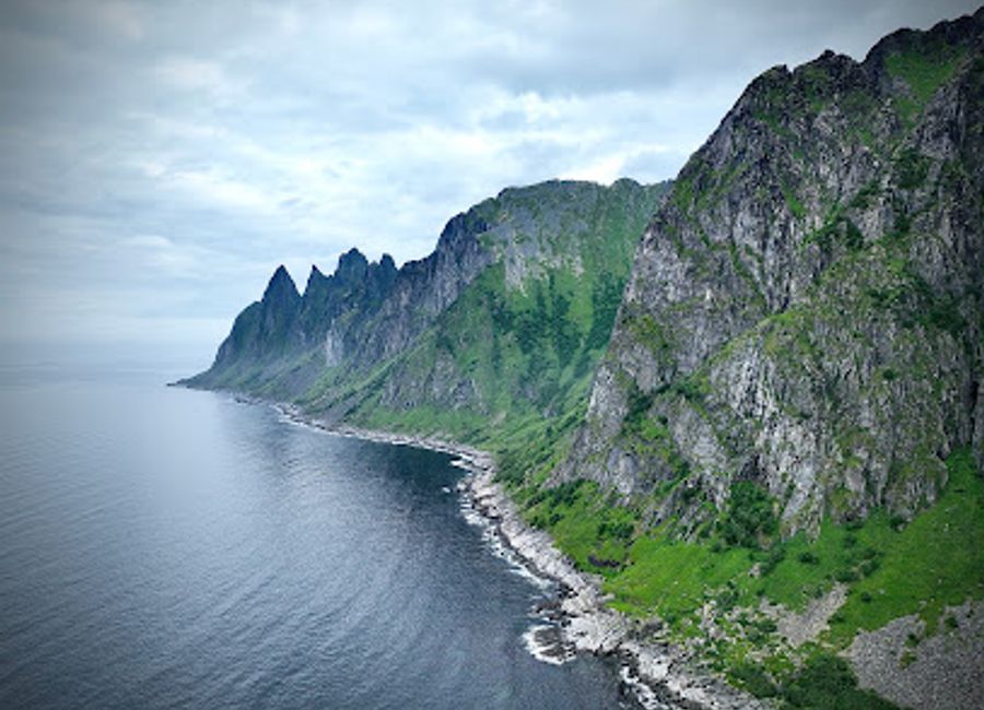 Explore Tungeneset, a breathtaking tourist attraction on Senja Island, where rugged beauty meets serene coastal views and iconic mountain peaks.