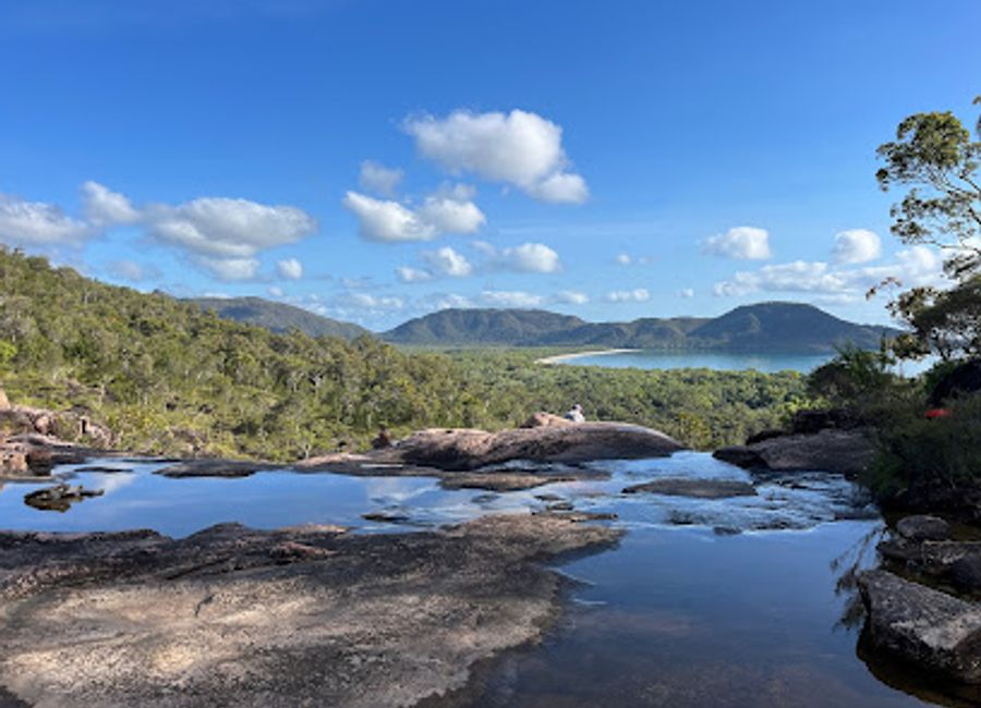 Hike the Thorsborne Trail: A world-class, 32km coastal trek through Hinchinbrook Island's diverse landscapes. Book your permit in advance!