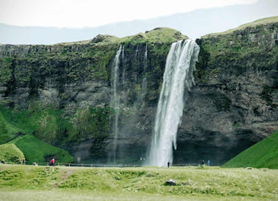 Discover the breathtaking Seljalandsfoss Waterfall, where you can walk behind cascading waters and immerse yourself in Iceland's stunning natural beauty.