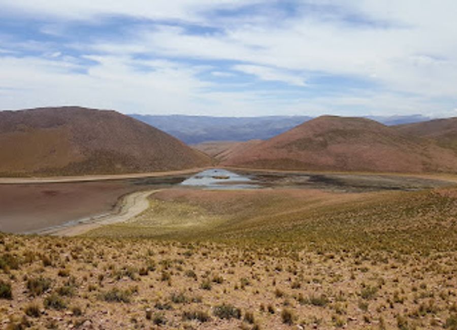 Experience the serene beauty of Laguna De Leandro in Humahuaca, a hidden gem surrounded by the stunning Andes mountains.