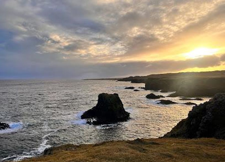 Discover the stunning vistas of Arnarstapi Cliff Viewpoint, where rugged cliffs meet the North Atlantic, offering unforgettable views and natural beauty.