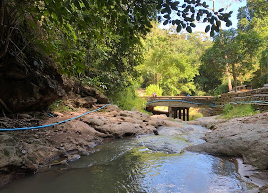Explore the serene beauty of Pam Bok Waterfall in Pai, Thailand, where crystal-clear waters and breathtaking landscapes await every traveler.
