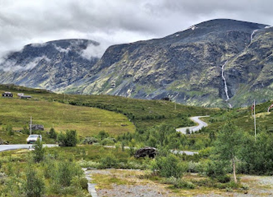 Experience the stunning vistas of Jotunheimen, where majestic mountains meet serene landscapes in Norway's breathtaking national park.