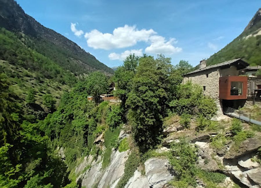 Explore the ancient Roman aqueduct of Pont d'Aël and experience breathtaking views in the heart of Aosta Valley's stunning landscapes.