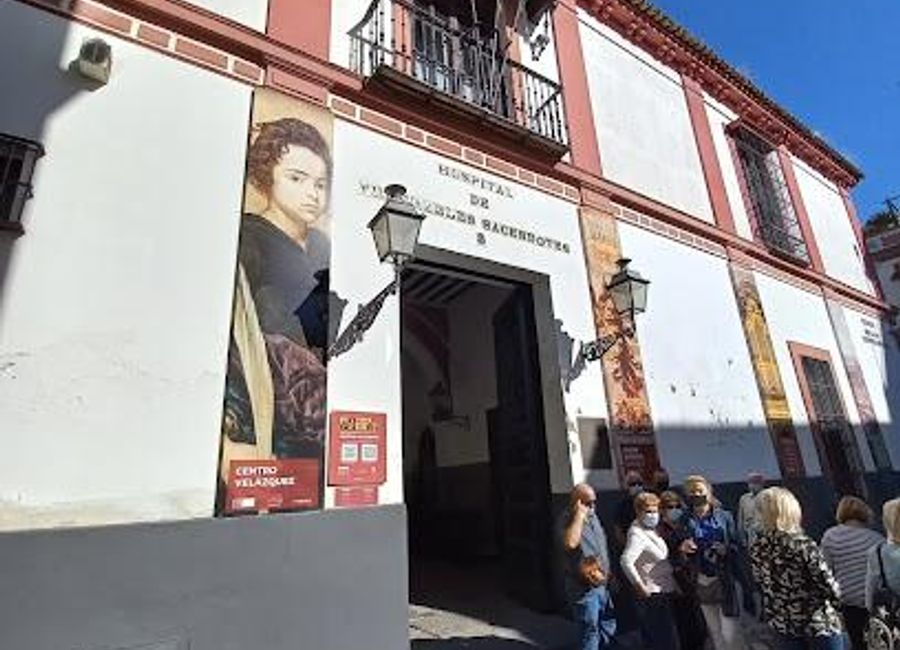 Explore the stunning Baroque architecture and serene atmosphere of Hospital los Venerables in the heart of Seville's historic district.