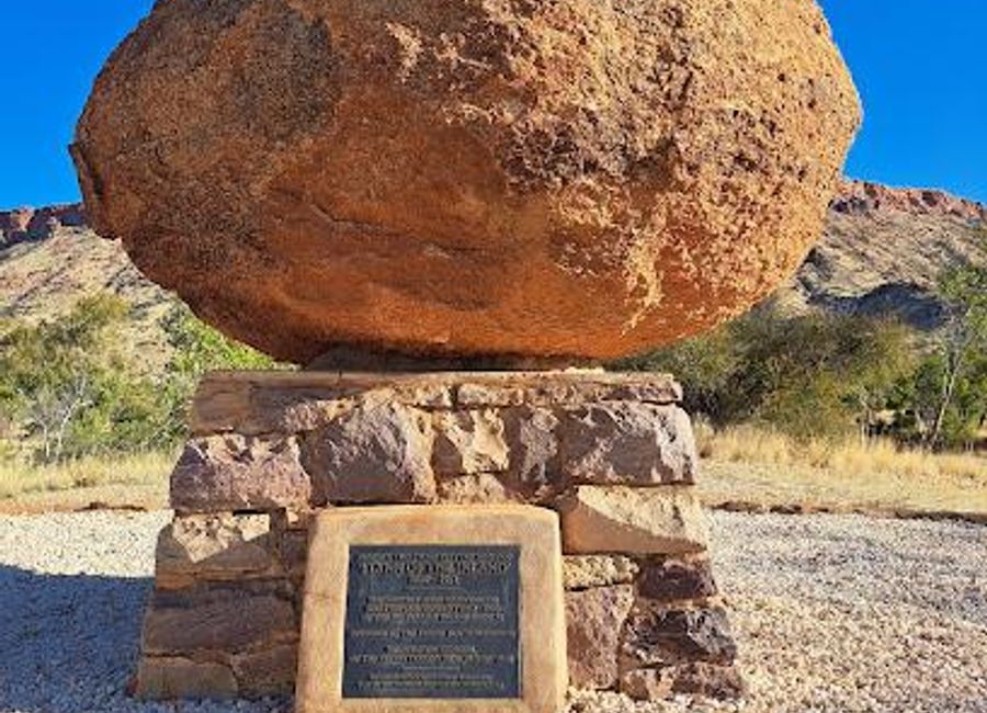 Explore the legacy of John Flynn at his grave, a historical landmark that celebrates the pioneering spirit of healthcare in remote Australia amidst stunning natural beauty.