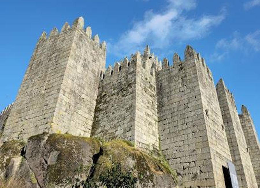 Explore Guimarães Castle, a historical landmark in Portugal, rich in culture and stunning architecture, perfect for an immersive travel experience.
