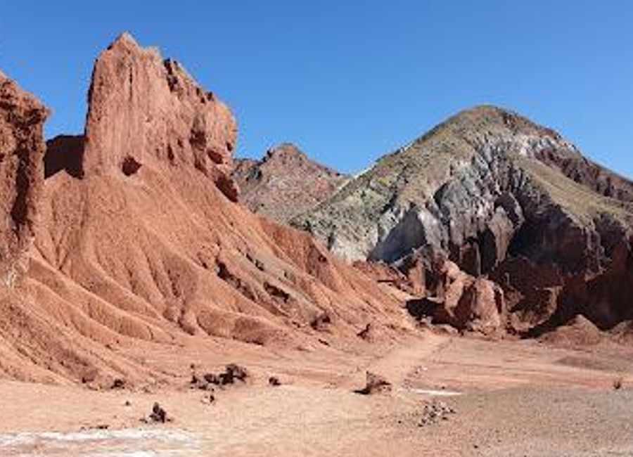 Experience the vivid colors of Valle del Arcoiris, a stunning natural wonder in San Pedro de Atacama, Chile, perfect for photography and exploration.