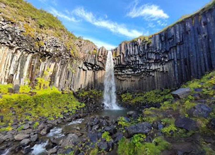 Discover the breathtaking beauty of Svartifoss, Iceland's iconic waterfall framed by unique basalt columns in Vatnajökull National Park.