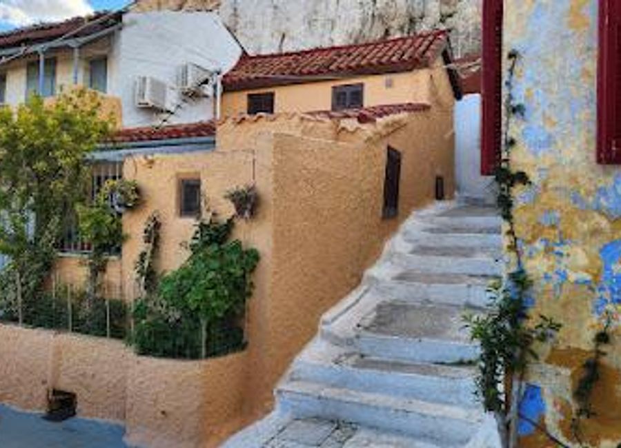 Explore Anafiotika, a serene neighborhood in Athens, where charming whitewashed houses and stunning views of the Acropolis await.