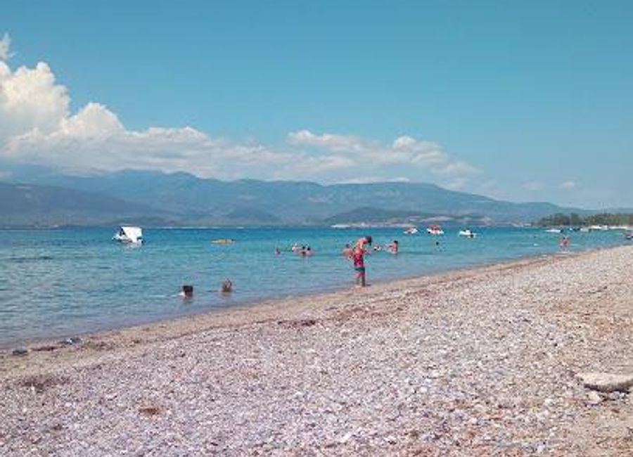 Explore Kavos Beach in Lichada, Greece, where crystal-clear waters meet golden sands for the ultimate beach experience.