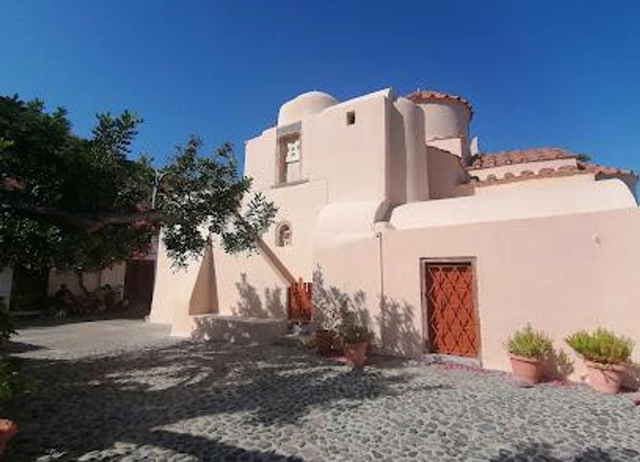 Explore Panagia Episkopi, a stunning Greek Orthodox church in Santorini, showcasing beautiful architecture and rich history amidst serene surroundings.