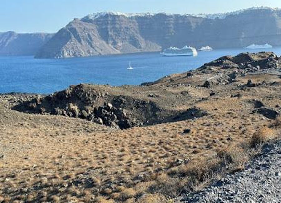 Explore the enchanting Nea Kameni Volcanic Park in Santorini, Greece, where volcanic landscapes and stunning views await your discovery.