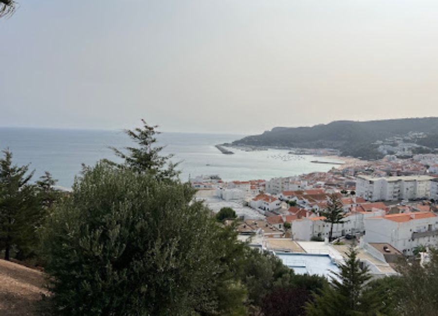 Experience the unforgettable sunsets of Sesimbra, where the sky lights up with captivating colors over the Atlantic Ocean, creating magical memories for every visitor.