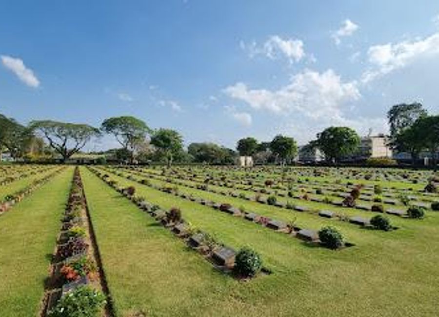 Explore the Kanchanaburi War Cemetery, a solemn yet beautiful tribute to the lives lost during World War II in Thailand's historic landscape.