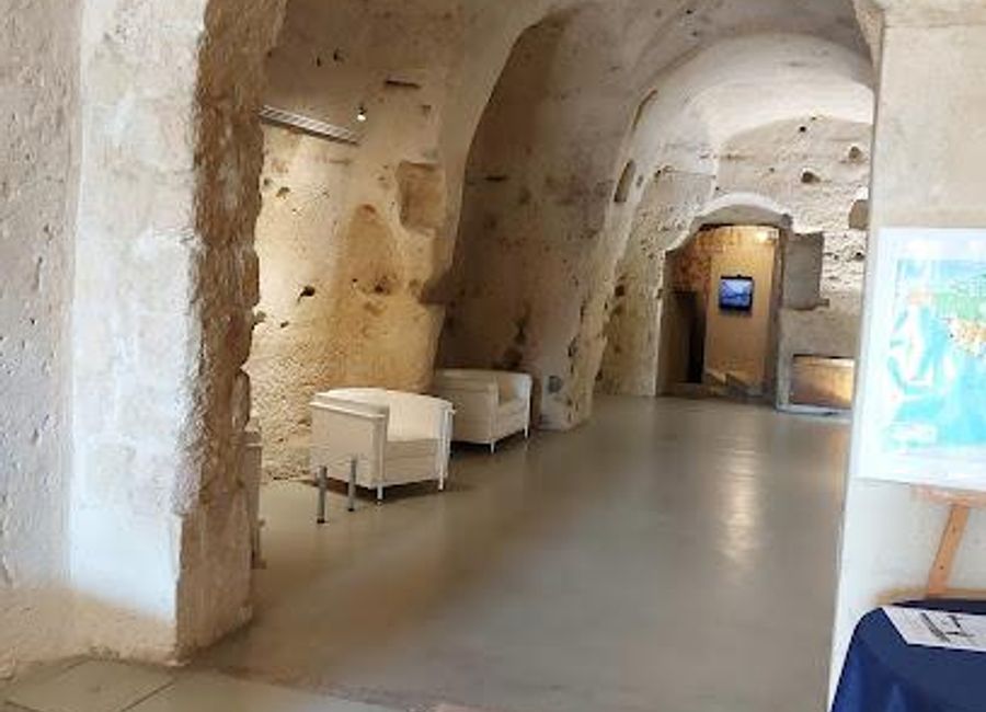 Explore the vibrant arts and culture at Casa Cava, a unique cultural center in Matera, Italy, showcasing local talent and historical significance.