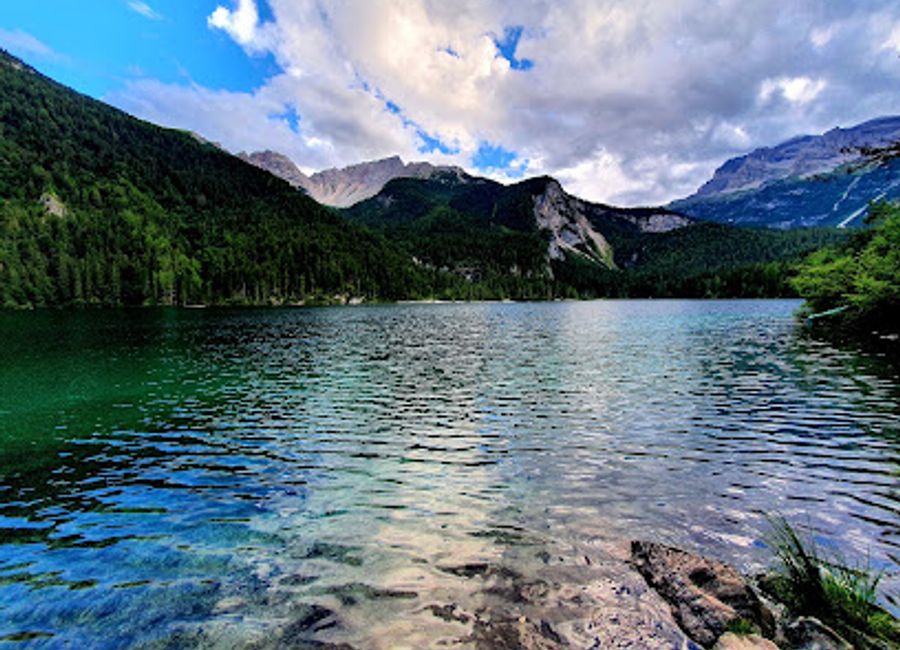 Discover the serene beauty of Lake Tovel, a stunning natural attraction perfect for swimming, hiking, and immersing yourself in breathtaking landscapes.