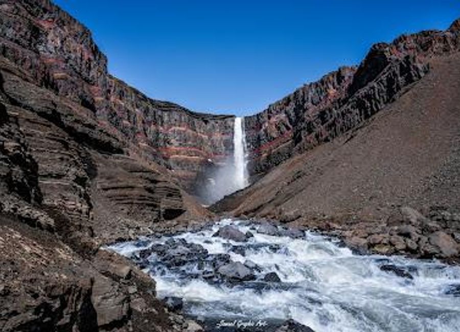 Explore Hengifoss, one of Iceland's tallest waterfalls, and embark on a scenic hike through stunning landscapes to witness nature's grandeur.