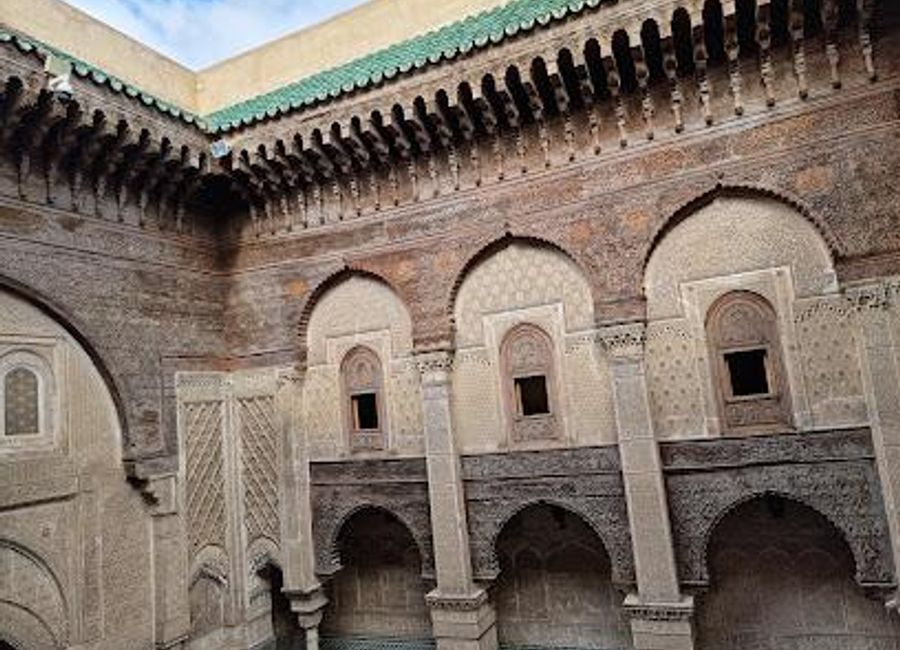Explore the enchanting Al Attarine Madrasa, a historical landmark in Fes showcasing intricate Moroccan architecture and rich cultural heritage.