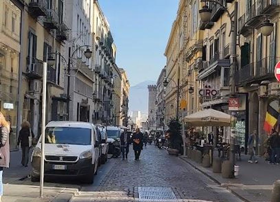 Discover the charm of Via Toledo in Naples, where historical landmarks meet modern shopping and vibrant street life.