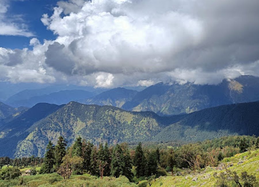 Hike to the 'Moon Rock' for panoramic Himalayan views and spiritual solace at the highest Shiva temple.